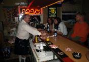 Kilted Magician Hugh Irwin behind the bar at the Hamburg Pub 