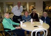 Here The Kilted Magician chats with seniors at Abbey Park after a show.